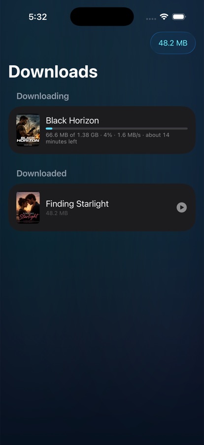 The Downloads screen: one film finished, another downloading with speed and time remaining